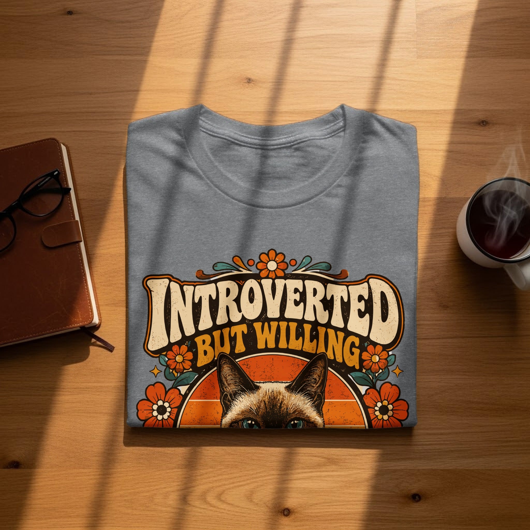 Gray t-shirt with "Introverted But Willing" text and floral design.
