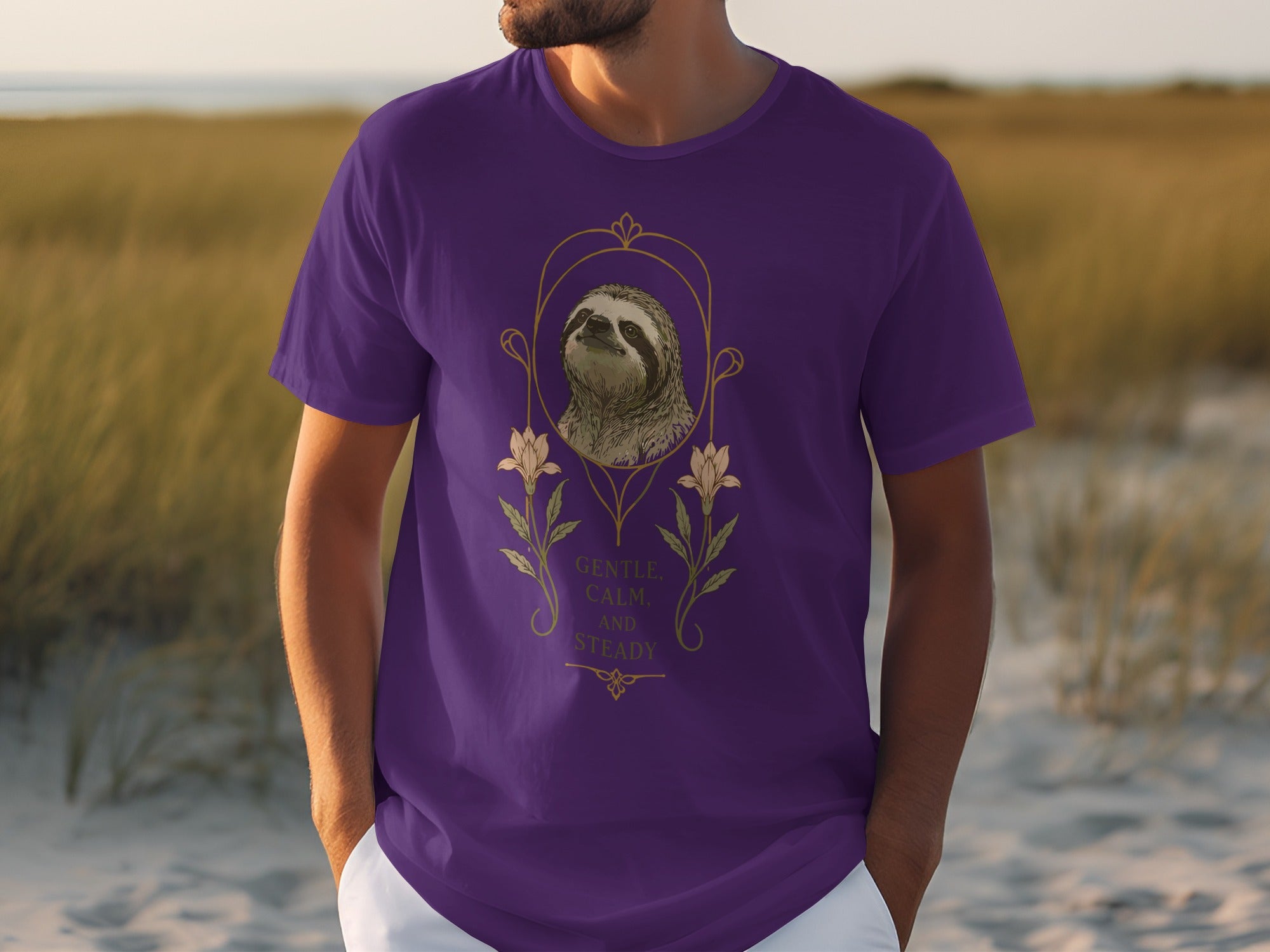 Purple t-shirt with sloth design and text "Gentle Calm and Steady".