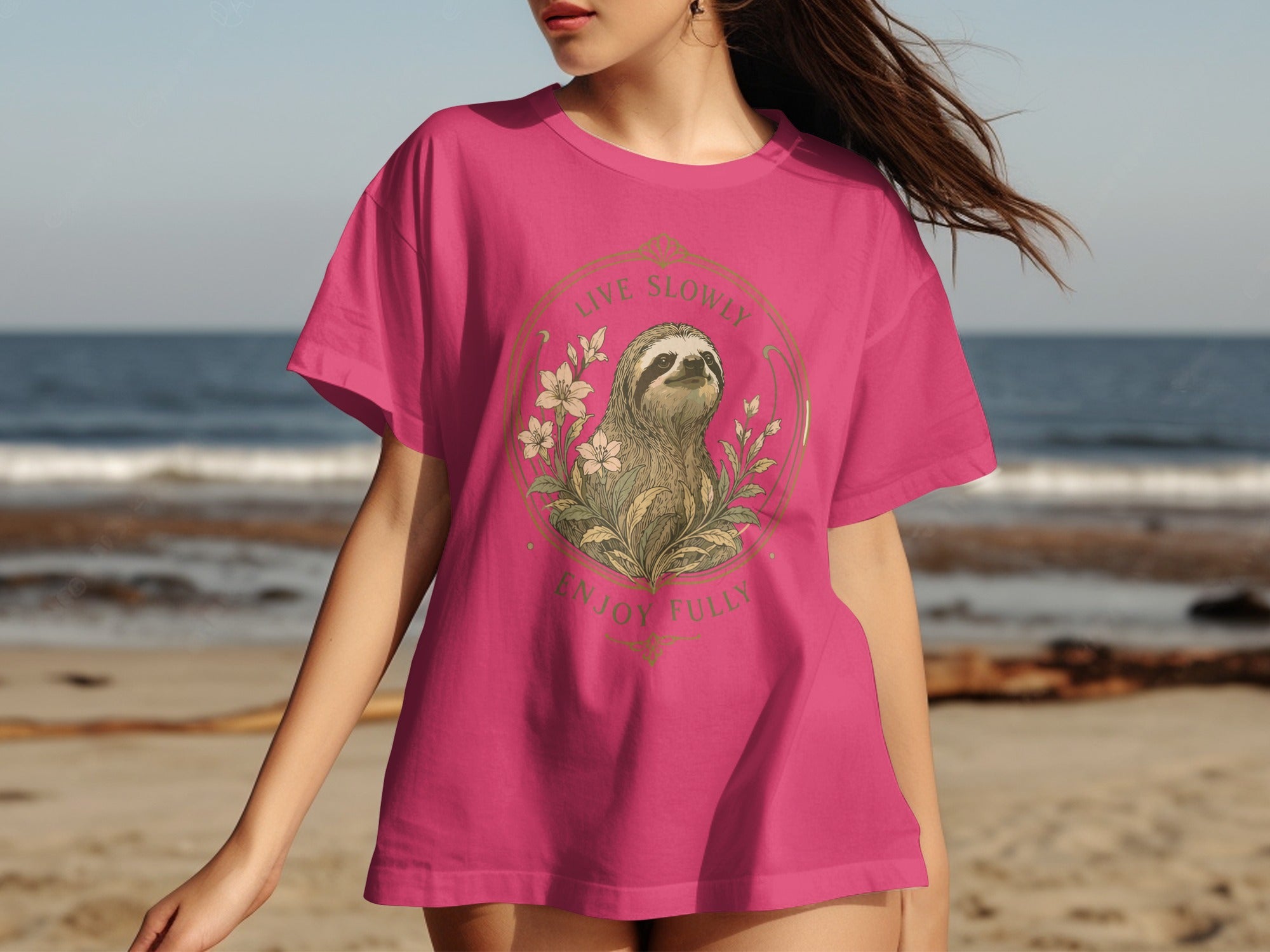 Pink t-shirt with a sloth, flowers, and text "LIVE SLOWLY ENJOY FULLY".