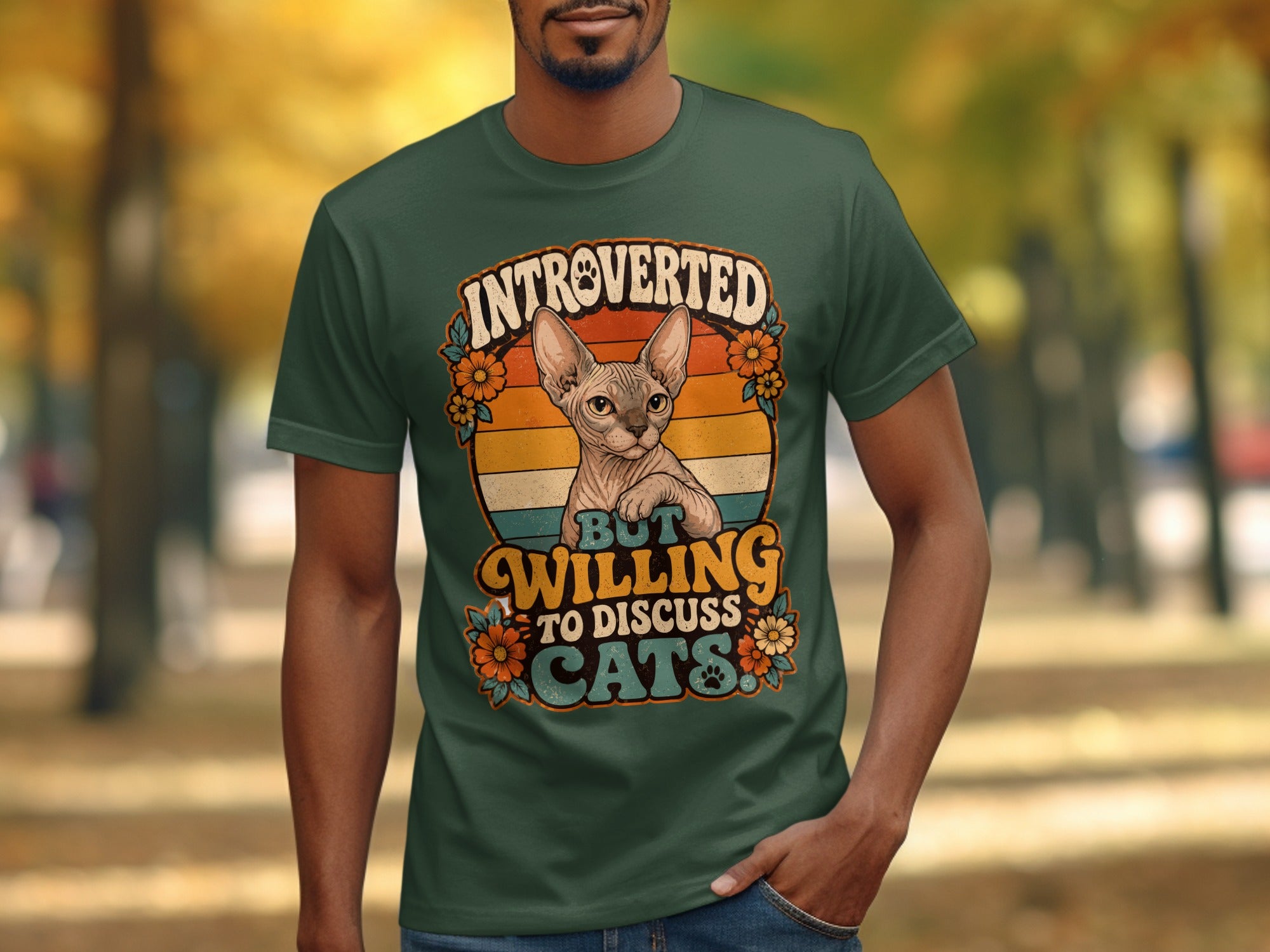 Green t-shirt with a cat and text "Introverted but willing to discuss cats".