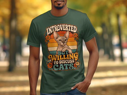 Green t-shirt with a cat and text "Introverted but willing to discuss cats".