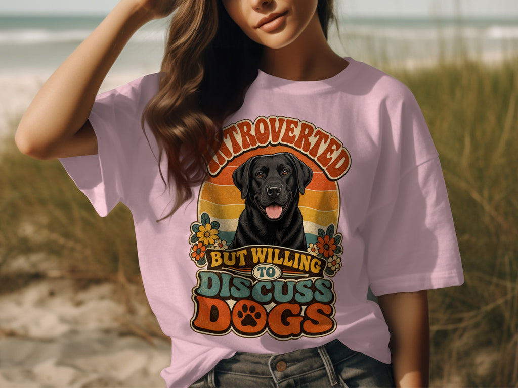 Pink t-shirt with retro graphic of a black lab and "Introverted but willing to discuss dogs."