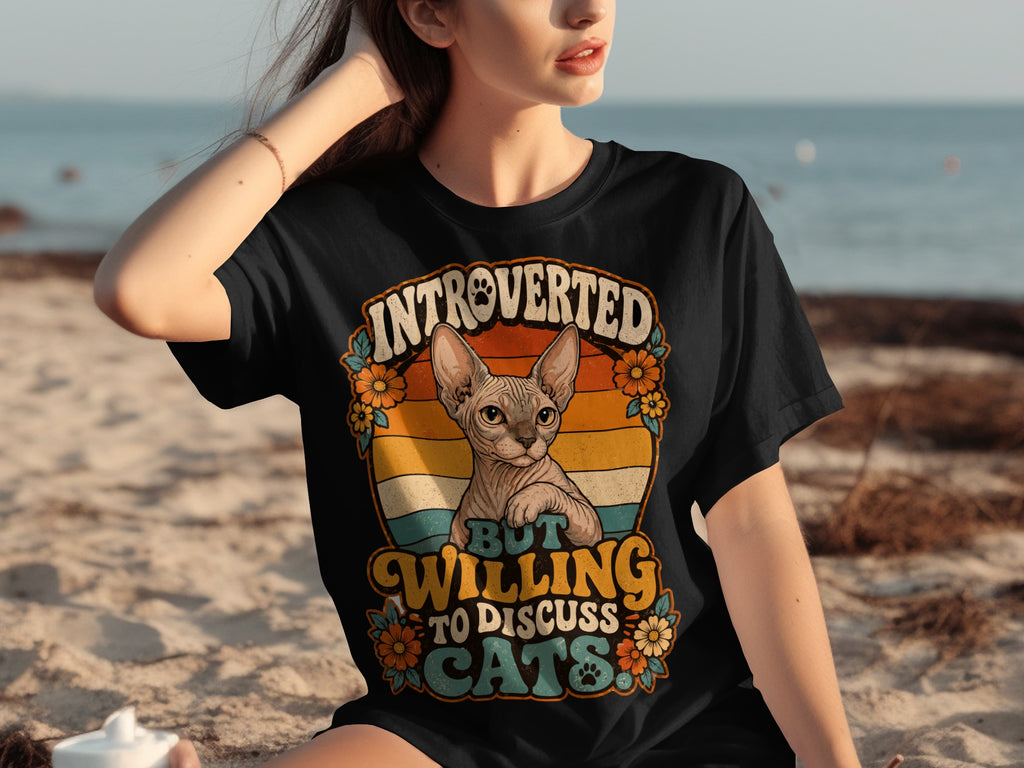 Sphynx cat wearing a crown with text "introverted but willing to discuss cats".