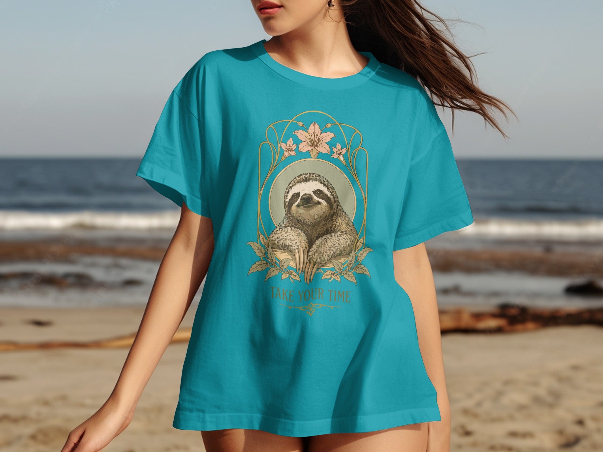 Blue t-shirt with a sloth in a decorative frame and text "TAKE YOUR TIME."