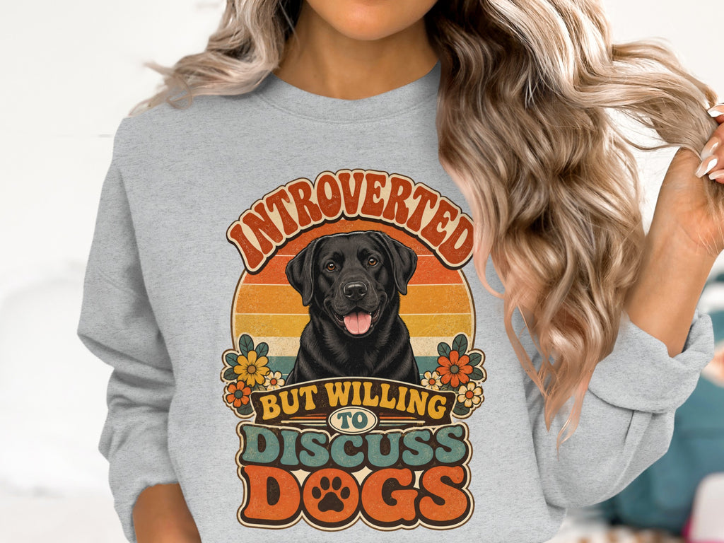 Black Labrador dog on crewneck sweatshirt with retro text and floral accents.