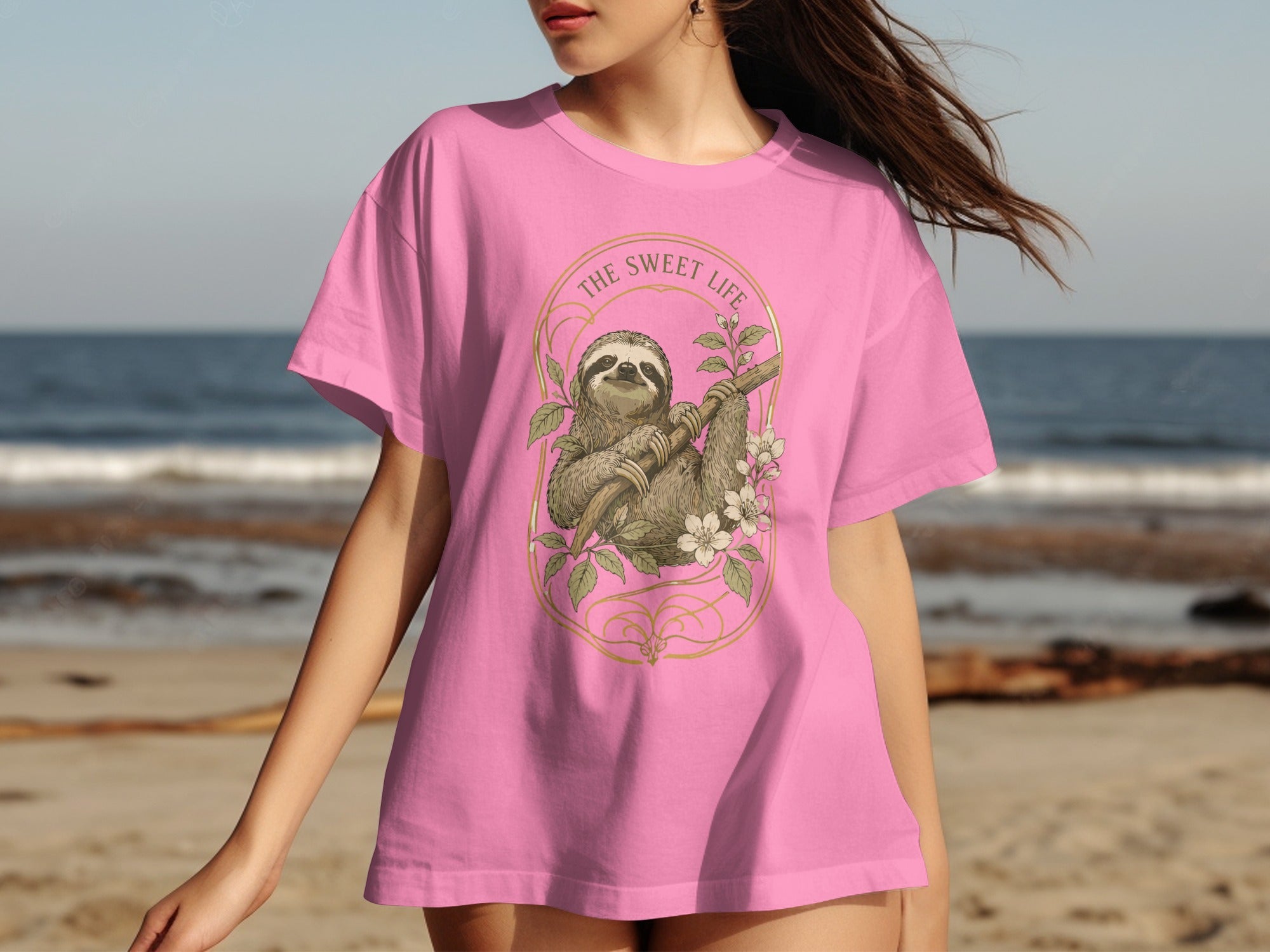 Pink t-shirt with sloth and "The Sweet Life" text in gold oval frame.