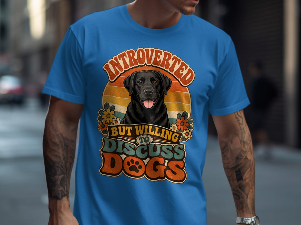 Black Labrador retriever on a blue t-shirt with text "Introverted but willing to discuss dogs".