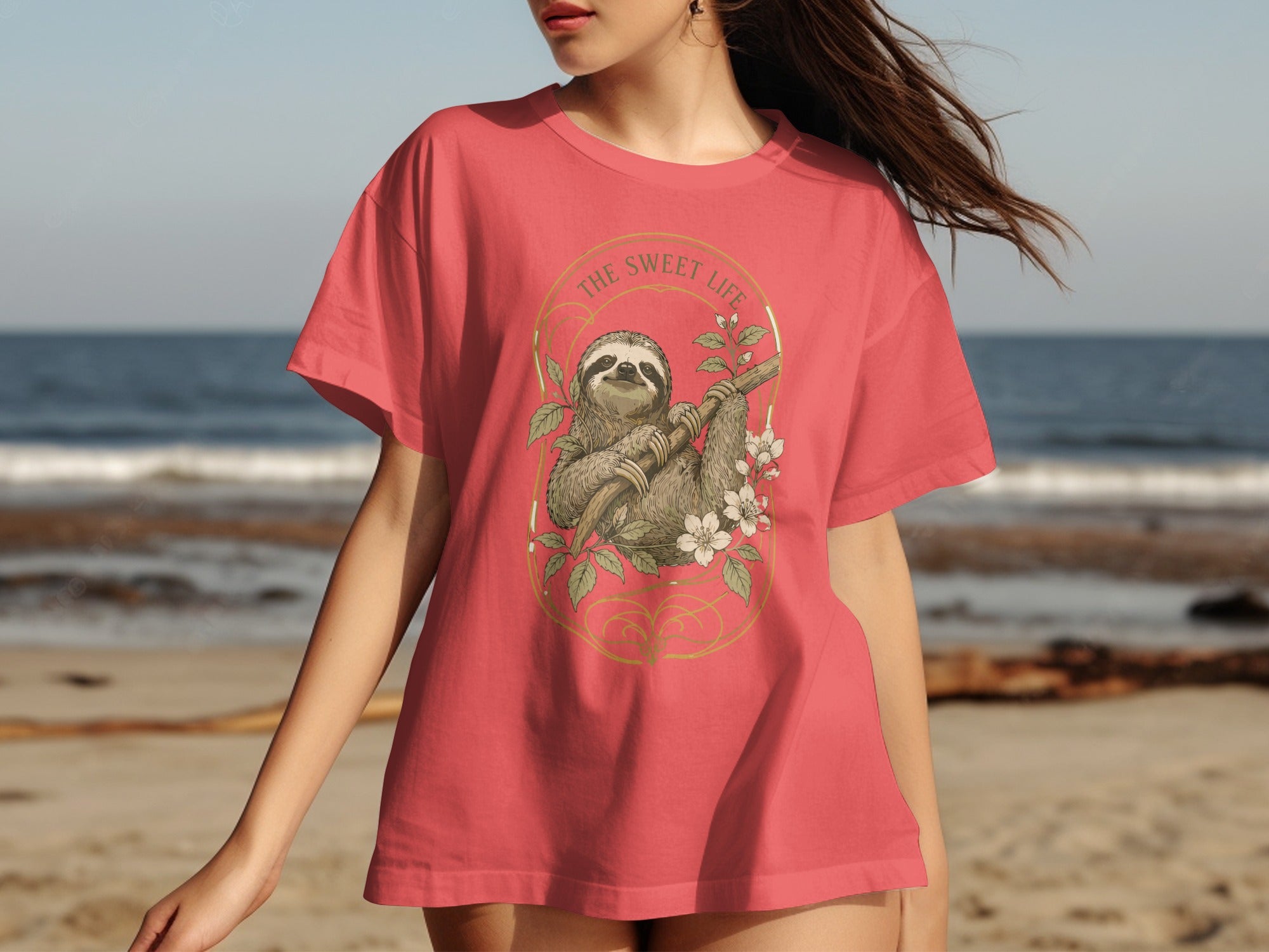 Coral t-shirt with sloth, branch, and flowers graphic with text "THE SWEET LIFE."
