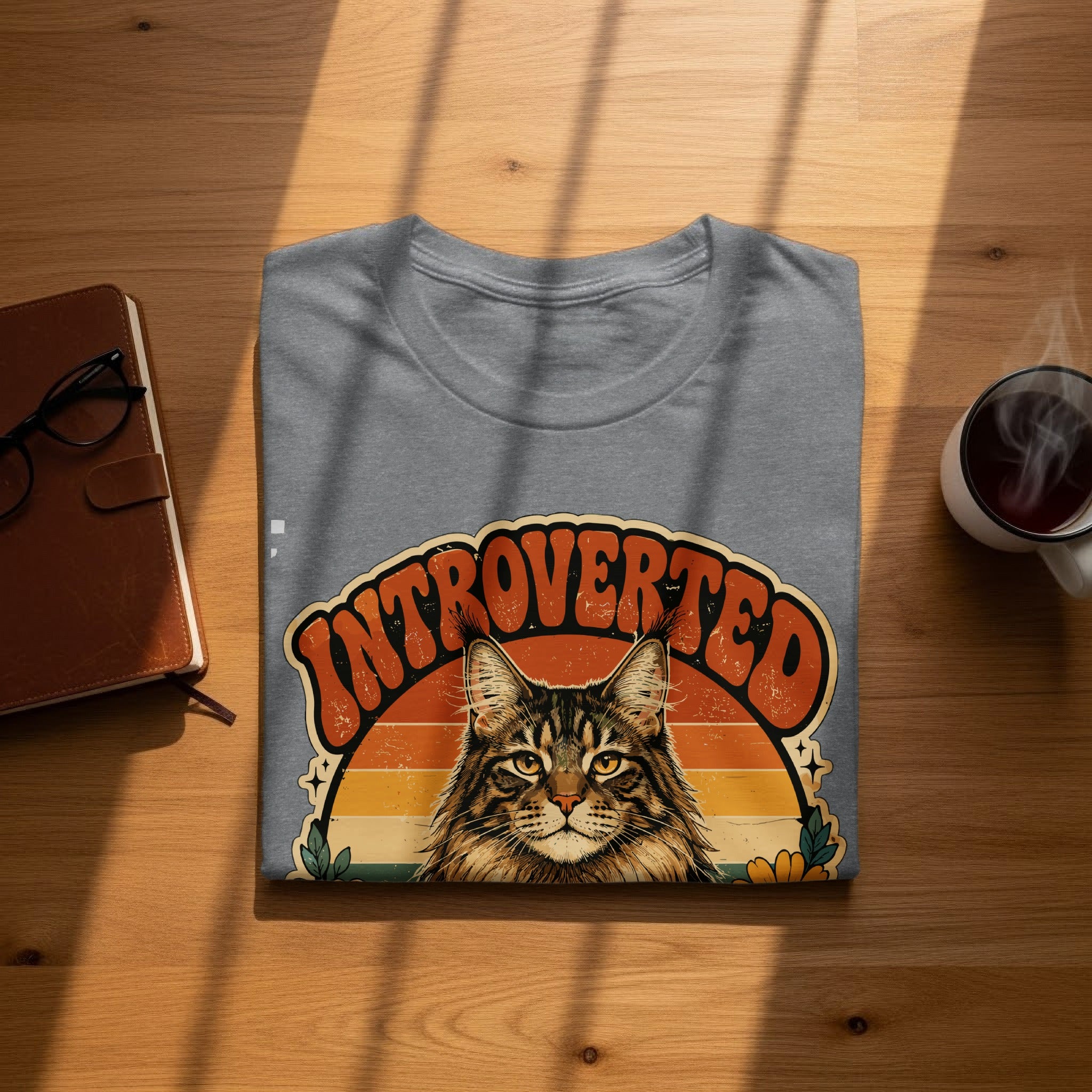 Gray t-shirt with "Introverted" text and a cat illustration.