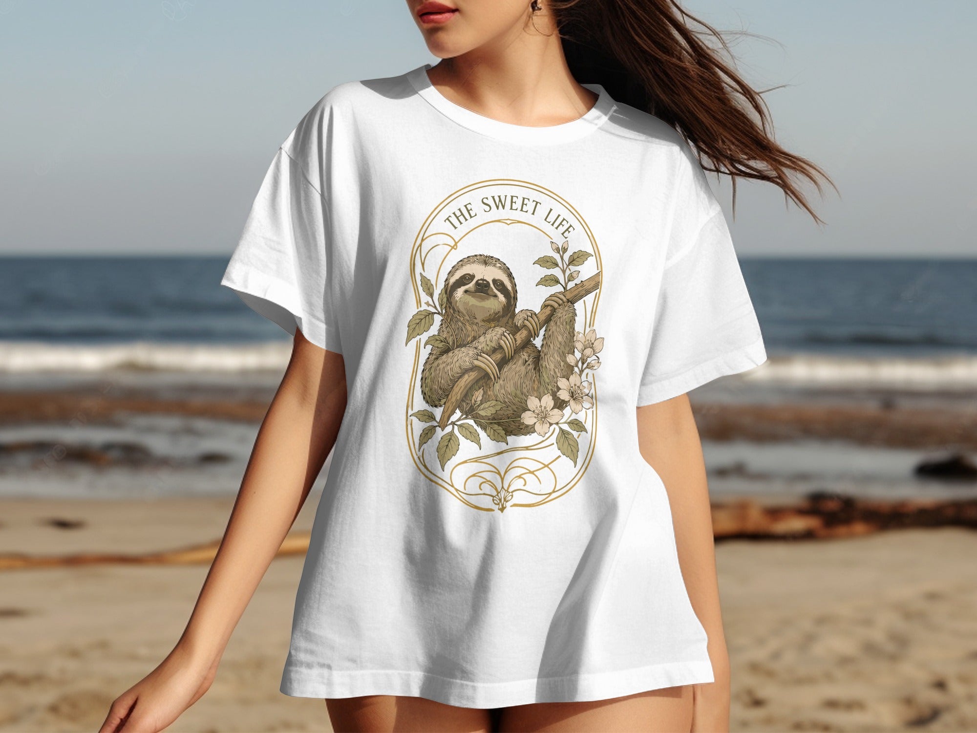 White t-shirt with oval graphic of a sloth, branch, and flowers.