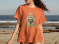 Orange t-shirt with sloth illustration and "TAKE YOUR TIME" text.