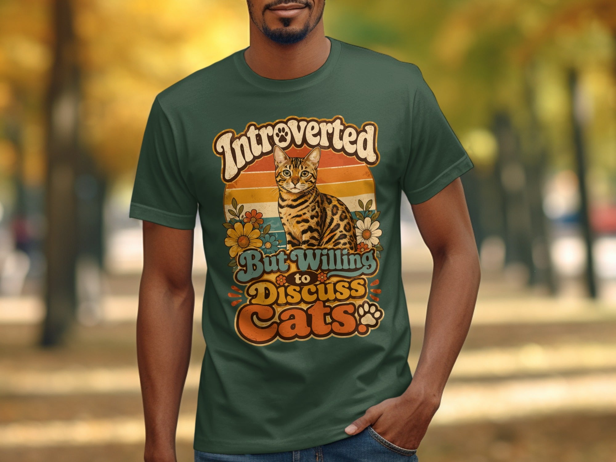 Green t-shirt with "Introverted but willing to discuss cats" and tiger-striped cat graphic.