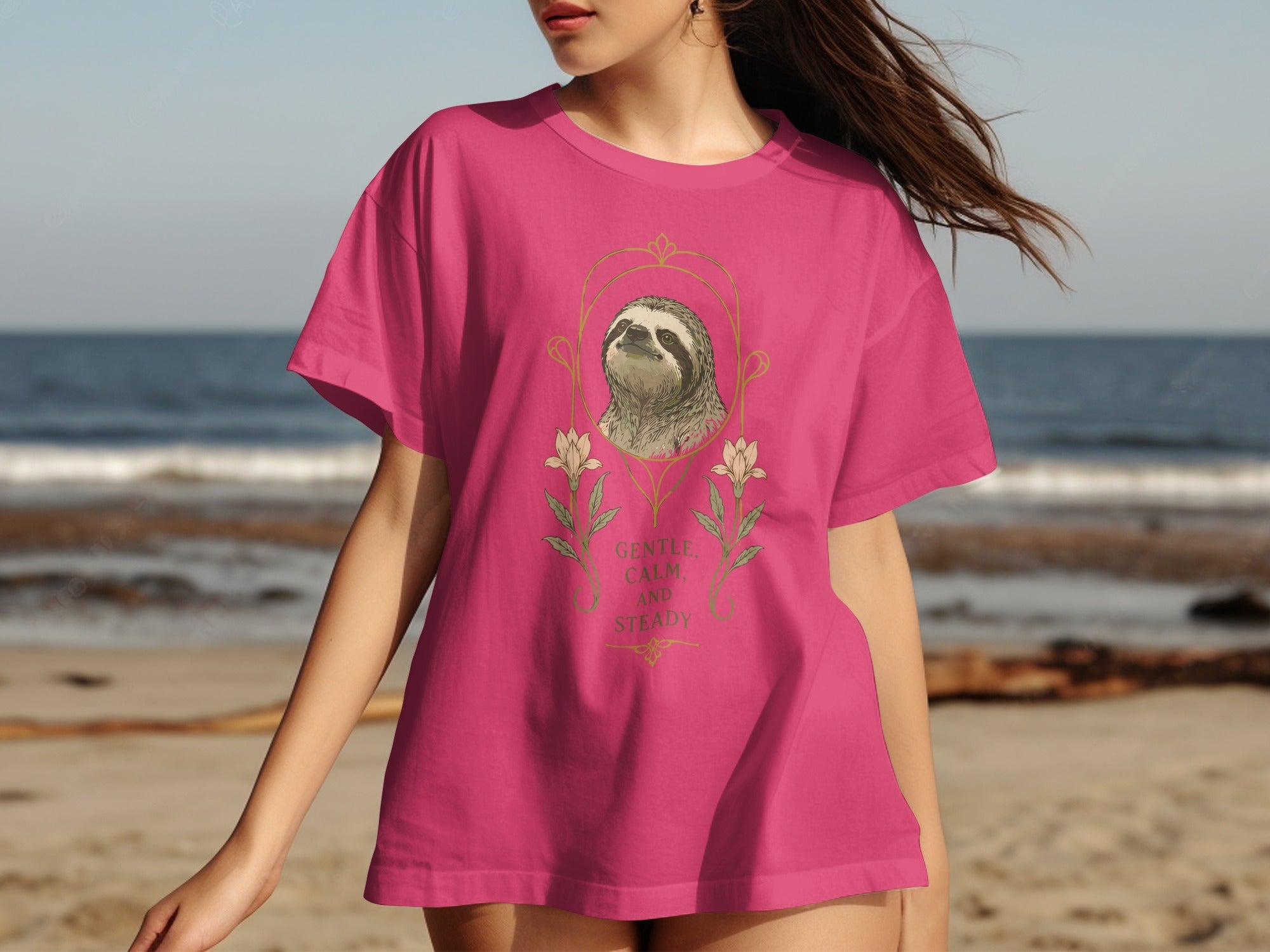 Pink t-shirt with a sloth and floral graphic and text "Gentle, Calm, and Steady."