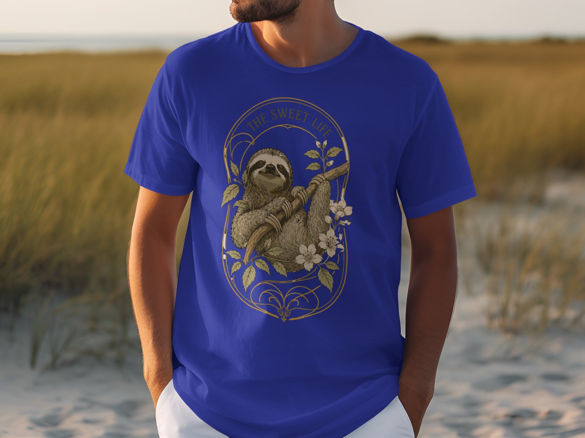 Blue t-shirt with a sloth hanging from a branch and the text "The Sweet Life".