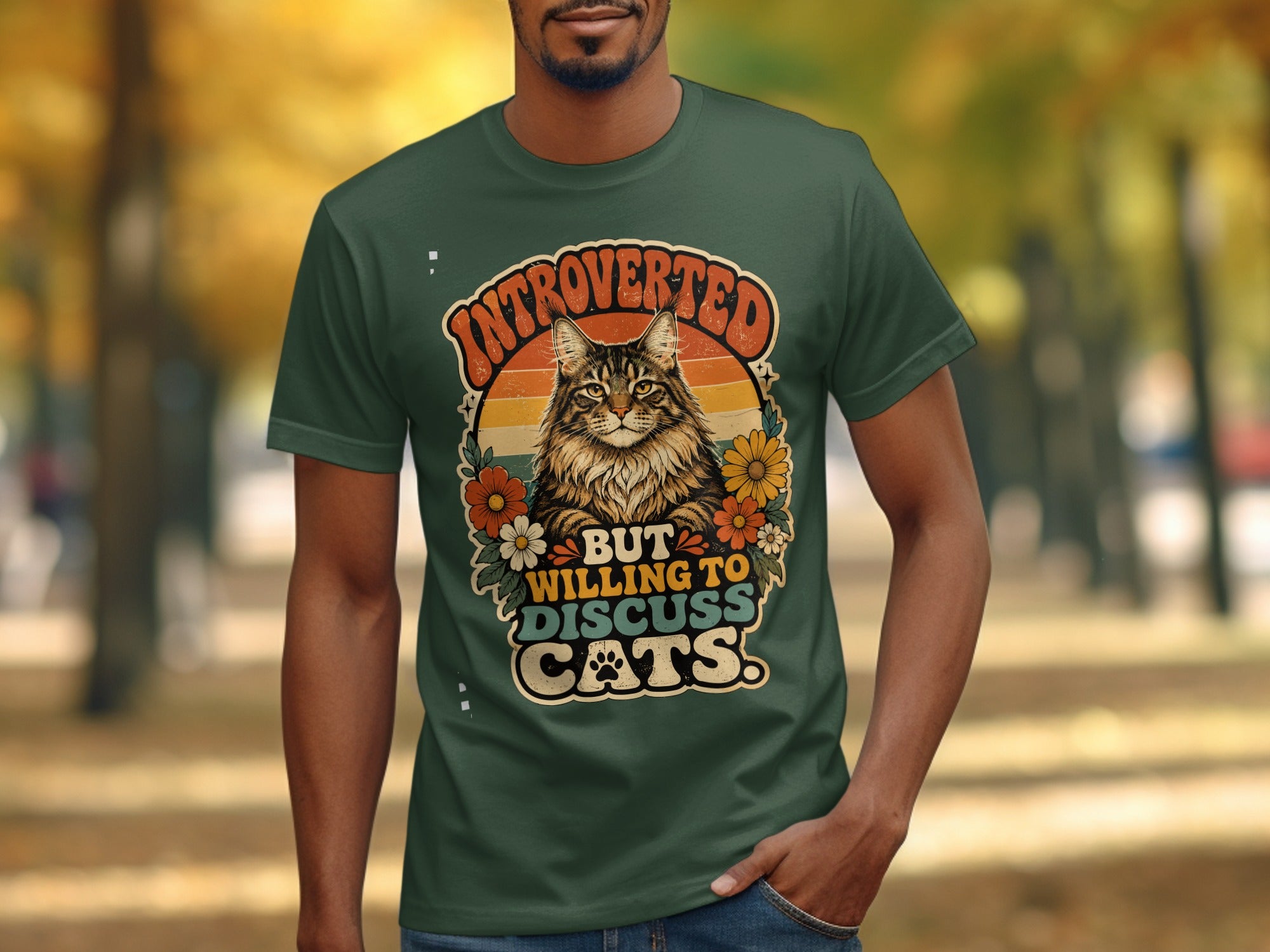 Green t-shirt with "Introverted but willing to discuss cats" text and a cat illustration.