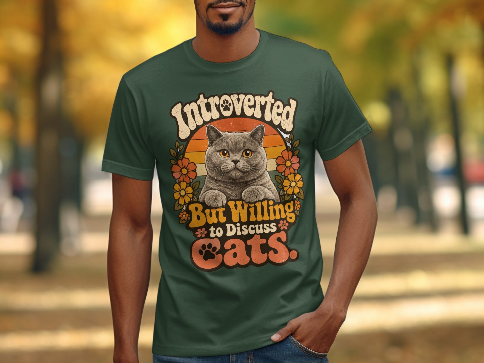 Dark green t-shirt with "Introverted but willing to discuss cats" text and a cat graphic.