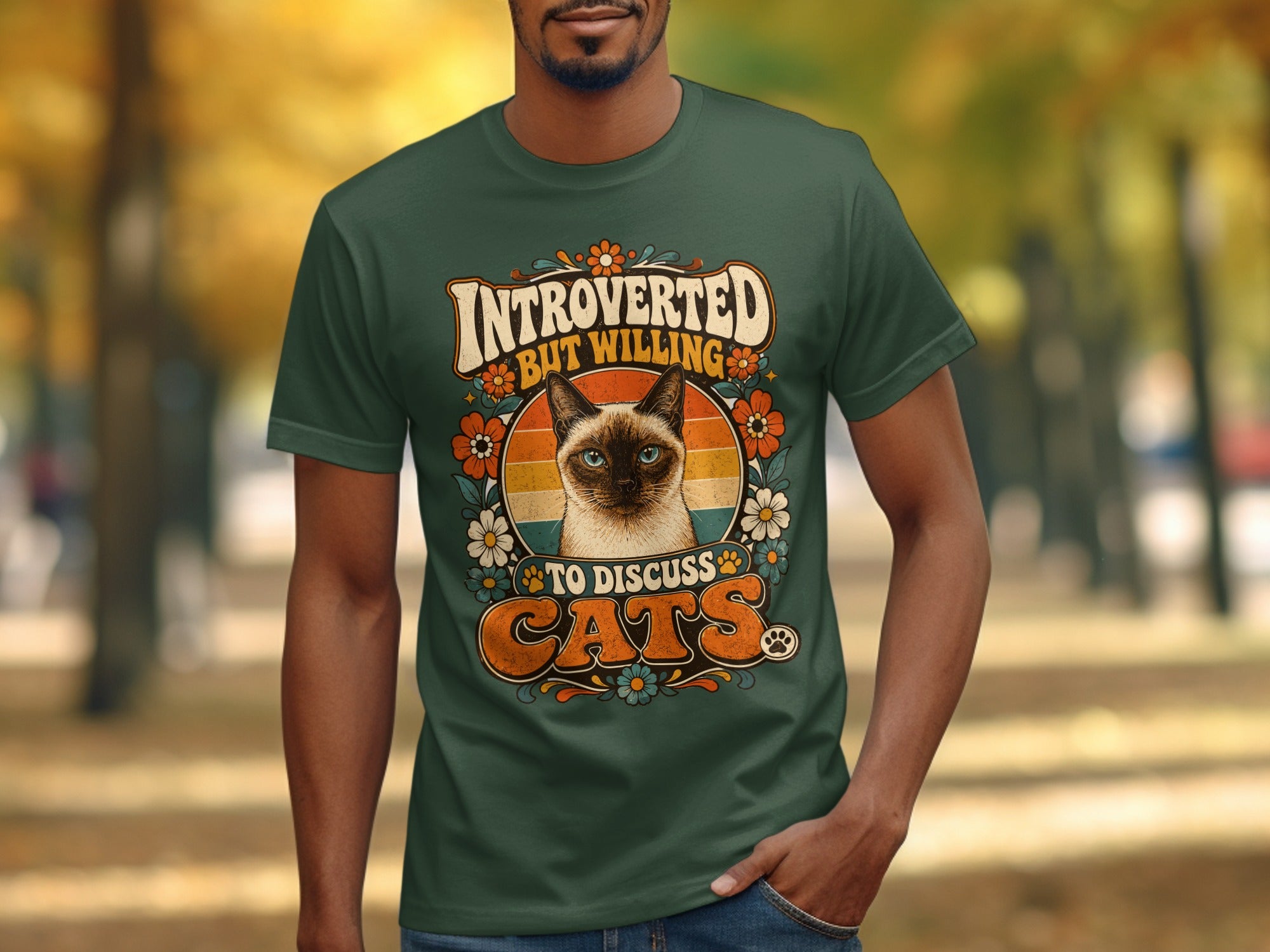 Green t-shirt with vintage design featuring a Siamese cat and text "Introverted but willing to discuss cats."